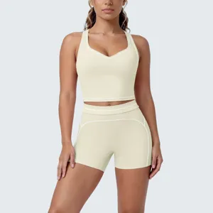 Detailed view of women's seamless athletic two piece gym yoga activewear set in light yellow.
