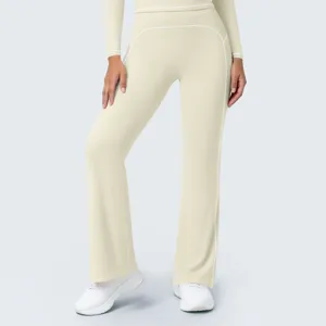 High waist flared yoga pants detail showing white contrast stitching and soft athletic fabric texture.