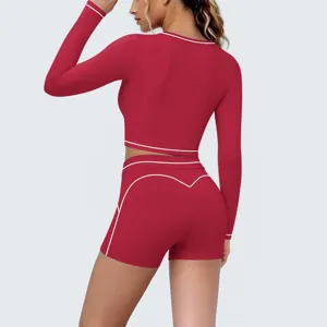Detailed back view of women's red long-sleeve crop top and matching yoga shorts set.