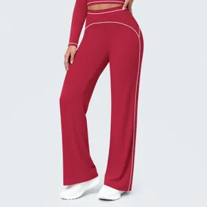 Red high-waist wide-leg fitness pants detail, white contrast piping, casual sportswear design.