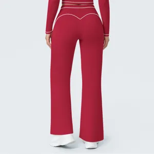 Red high waist wide leg yoga pants set back view detail showcasing contrast white piping.