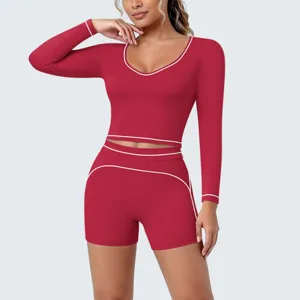 Red activewear set long sleeve crop top and shorts contrast piping fitness yoga detail.