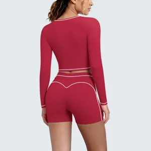 Red long sleeve crop top back view detail and high waist yoga shorts sportswear set.