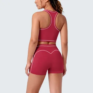 Detail view of red contrast piping racerback yoga top and shorts set for fitness running.