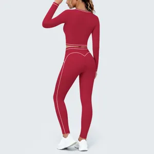Detailed view of women's red contrast piping long sleeve crop top yoga set for fitness gym workouts.