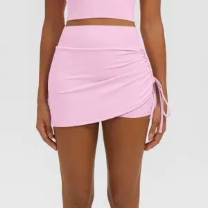 Pink high-waist ruched athletic skort detail, breathable nude-feeling yoga workout skirt.