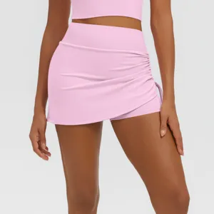 High waist pink pleated sports skirt shorts, breathable fitness yoga fake two-piece athletic wear.