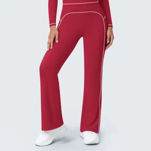 Detail shot of women's high waist contrast piping red wide leg active pants for fitness and yoga.