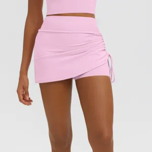 Pink pleated yoga skort detail, high waist athletic shorts for women fitness running wear.