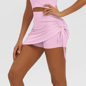 Detailed view of women pink high waist side drawstring yoga skort fitness athletic shorts.