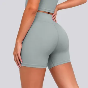High-waisted athletic yoga shorts detail featuring seamless stretch fabric and flattering fit.
