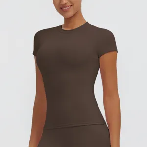 Detailed view of women's short-sleeve slim fitness top showing dark brown fabric.