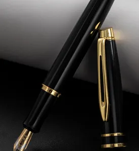 Luxury metal fountain pen close-up showing gold nib detail and elegant black body design.