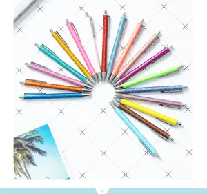 Colorful glitter retractable ballpoint pens set, sparkling office and school stationery supplies.