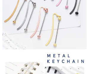Detailed view of colorful metal bookmarks with sleek long bars and cute round bead pendants.
