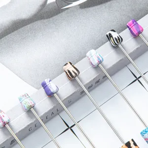 DIY beaded ballpen with colorful printed beads and metal stem creative student stationery.