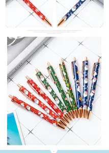 Christmas retractable ballpoint pens set with cute Santa and snowflake cartoon patterns.