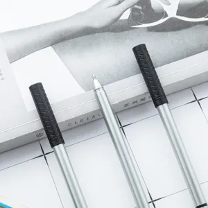 Silver ballpoint pen with textured black grip, sleek design, ideal office and school supply.