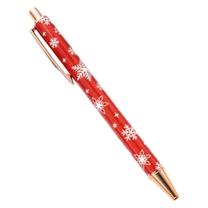 Christmas retractable ballpoint pen with red snowflake pattern and rose gold metal trim.