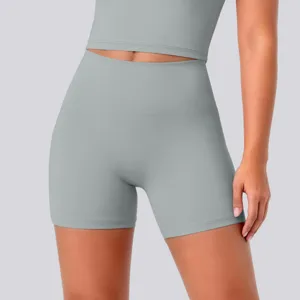 Close-up view of high-waisted yoga shorts in grey, featuring high elasticity and breathable fabric.