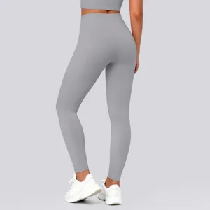 Back view detail of high waisted grey yoga leggings with seamless design and shaping fit.