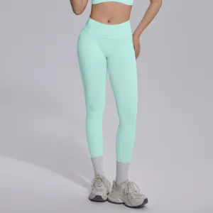 Seamless knit mint green V-waist yoga pants, breathable push-up fitness leggings detail.