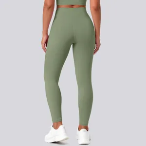 Detail view of the high-waisted seamless yoga leggings in a sleek olive green color design.