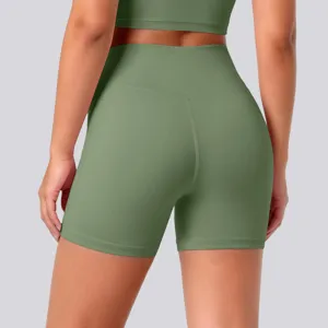 Detail view of high-waisted olive green yoga shorts showing back seam and contour fit.