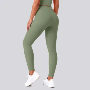 Detail view of high-waisted seamless yoga leggings in green, designed for fitness and running.