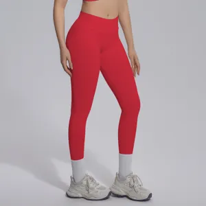 Seamless red yoga leggings close-up, highlighting high waist design and flexible ribbed knit fabric.