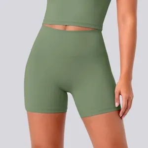 High-waisted yoga shorts detail view, seamless high-stretch fitness apparel close-up shot.