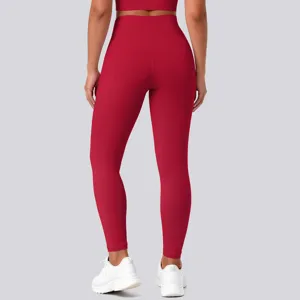 Back view detail of high-waisted red yoga leggings, featuring stretch fit and butt lifting design.