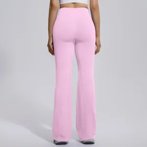 Pink high-waist flare yoga pants for women, seamless workout fitness leggings with cross waist.