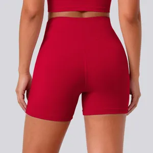 Back view detail of high-waist red yoga shorts, showing comfortable stretch fit and shape.