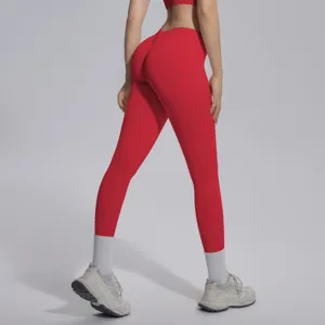 Detail view of red seamless high V-waist butt lifting yoga pants, breathable activewear.