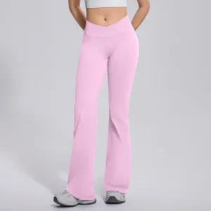 Pink crossover waist flare yoga pants, high elastic fitness pants detail view design.