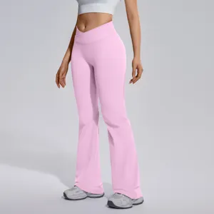 Close-up view of pink crossover high waist flare yoga pants featuring stretchy soft fabric.