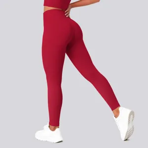 High-waisted seamless red yoga leggings with butt-lifting design for active fitness workouts.
