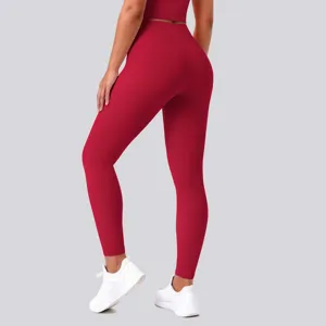 Back view detail of high waisted red seamless yoga pants, stretch fitness leggings for women.