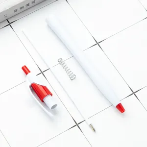 White and red retractable plastic ballpoint pen disassembled parts, neat flat lay display.