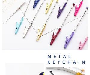 Colorful metal memo clips with long stems for card holder and DIY craft display projects.