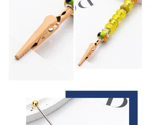 Close-up detail view of DIY metal beaded alligator clip and memo holder craft accessory.