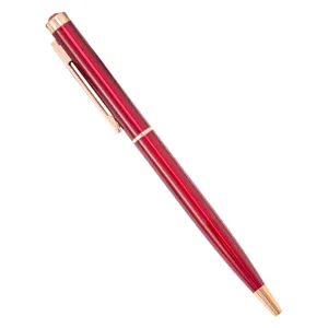 Elegante metalen balpen met roségouden accenten en rode kristallen top voor kantoor en cadeaus.