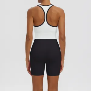 Detailed view of the athletic sports bra and tight yoga shorts, showcasing fine stitching.