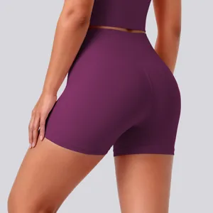Close-up detail of high-waisted athletic yoga shorts in purple, soft stretch fabric.