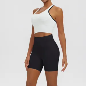 Detail shot of women's athletic sports bra and high-waisted shorts set, breathable and tight fit.