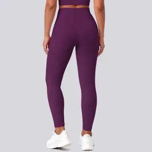 Back view detail of high-waist solid purple yoga leggings showing supportive fit and stretch.