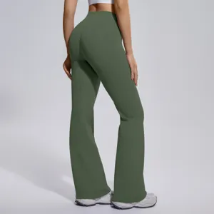 Back detail of high-waisted flared yoga pants in dark green, showing butt-lifting fit.