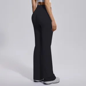 High waist crossover flared yoga pants back view showing stretchy athletic fit and shaping.