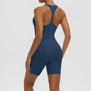 Women's solid color sports yoga set, breathable racerback tank top and tight biker shorts.